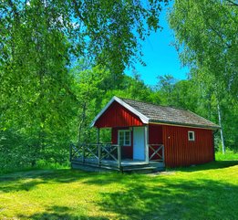 Stuga med skogen som granne i Dalsland